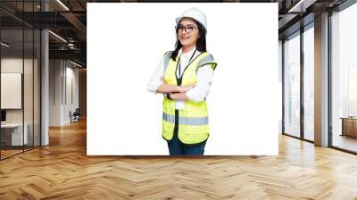 Beautiful young female architect wearing a helmet crossing her arms on her chest isolated transparent Wall mural