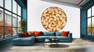 Top view of delicious cashew nuts in a white bowl Isolated Background Wall mural