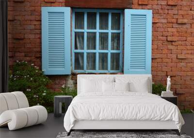 Blue window on red brick wall Wall mural