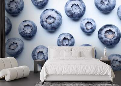 Flat lay composition of ripe blueberries on a blue background. blueberry pattern. Wall mural