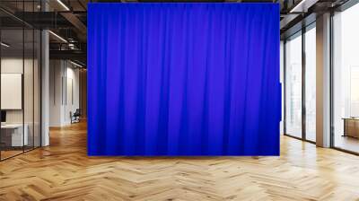 Blue closed curtain with a light spot Wall mural