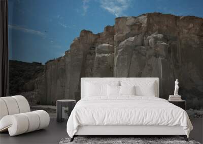 A large cliff of soft rock that results from a mining place of lime stone Wall mural