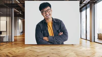 asian man portrait young male wear eye glasses smiling cheerful look thinking position with perfect clean skin posing on white background.fashion people life style concept Wall mural