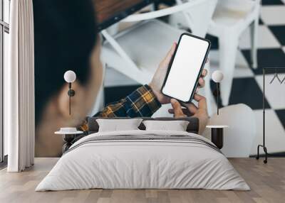 cell phone blank white screen mockup.woman hand holding texting using mobile on desk at office.background empty space for advertise.work people contact marketing business,technology Wall mural