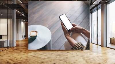 cell phone blank white screen mockup.woman hand holding texting using mobile on desk at office.background empty space for advertise.work people contact marketing business,technology Wall mural