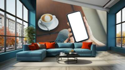 cell phone mockup blank white screen.woman hand holding texting using mobile on desk at coffee shop.background empty space for advertise.work people contact marketing business,technology Wall mural