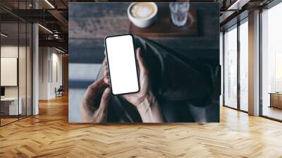 cell phone Mockup image blank white screen.woman hand holding texting using mobile on desk at coffee shop.background empty space for advertise.work people contact marketing business,technology Wall mural