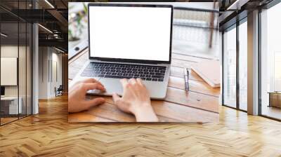 computer screen blank mockup.hand woman work using laptop with white background for advertising,contact business search information on desk at coffee shop.marketing and creative design Wall mural