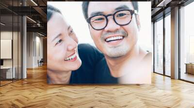 couple love concept.asian lover man and women taking a selfie while travelling on holiday hug each other.photo of people smile enjoy  Beautiful romantic time Wall mural