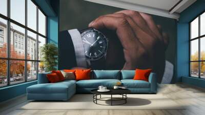 looking at luxury watch on hand check the time at workplace.concept for managing time organization w Wall mural