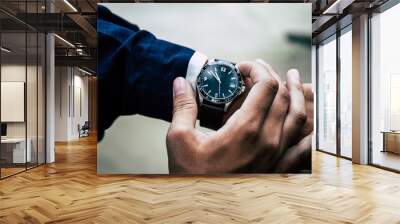 looking at luxury watch on hand check the time at workplace.concept for managing time organization working,punctuality,appointment.fashionable wearing stylish Wall mural