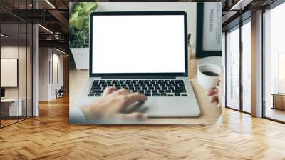 mockup image blank screen computer with white background for advertising text,hand woman using laptop contact business search information on desk at coffee shop.marketing and creative design Wall mural