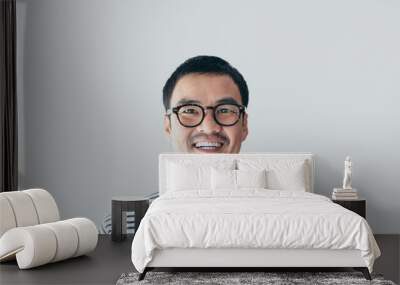 portrait young asian man wear eye glasses Smiling cheerful look thinking position with perfect clean skin posing on white background.fashion people freedom life style concept Wall mural