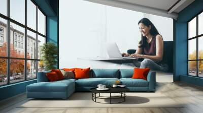 using computer.hand typing keyboard laptop online chatting search form internet while working sitting on sofa.concept for work from home.technology device contact communication business people Wall mural