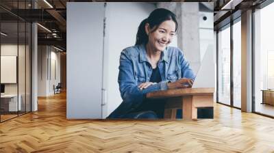 woman using computer.hand typing keyboard laptop online chatting search form internet while working sitting at coffee shop.concept for.technology device contact communication business people Wall mural