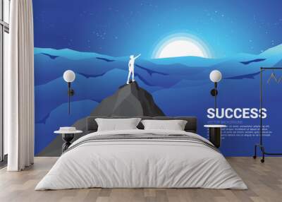 silhouette of businessman point forward from mountain cliff to the moon at night. Concept of business vision mission and goal Wall mural