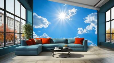 Clear blue sky with a few white clouds, serene weather, bright sunlight Wall mural