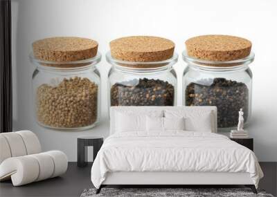 Glass spice jars with cork lids, isolated on a white background, highlighting an organized, eco-friendly kitchen. Wall mural