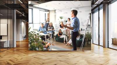 Creative business team technology and office concept boss talking to business team Wall mural