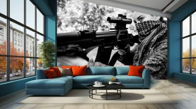 Girl soldier with a sniper rifle in his hands. Military concept of women's army black and white photo Wall mural