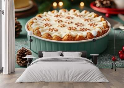 A beautifully decorated dessert pie topped with frosting and festive snowflake designs, surrounded by pine cones and holiday decorations. Wall mural