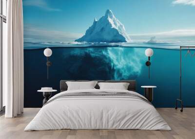 A large ice block is floating in the ocean. The water is blue and the sky is clear Wall mural