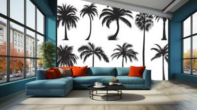 A set of isolated black vector silhouettes of various palm tree designs on a white background. Wall mural