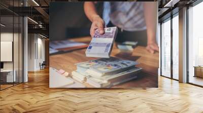 Businessman giving EURO money for exchange to dollars money Wall mural