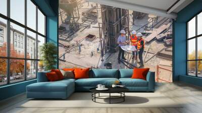 Structural engineer and foreman worker with blueprint discuss, plan working for building construction site.	 Wall mural