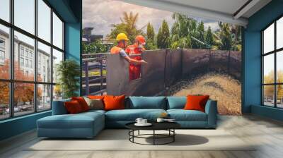 Two technicians are maintenance with water turbine at wastewater treatment system. Wall mural