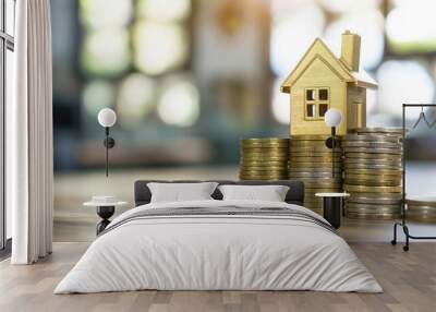 stack coins and house wood model ,concept idea for save and purchase house,growth business time Wall mural