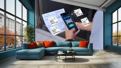 Online bill payment concept.Hands holding mobile phone to scan barcode on blurred Electric bill as background Wall mural