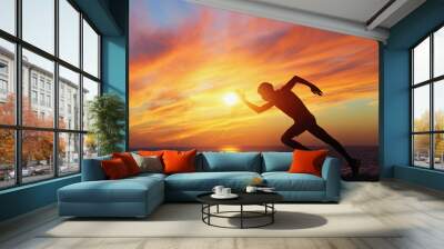 A man running on the beach at sunset. - Image Wall mural