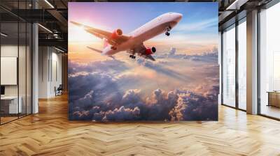 Landscape with aircraft is flying above clouds in the blue sky. Travel background with passenger plane. Commercial airplane. Private jet. Fast Travel and transportation concept Wall mural