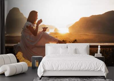 Women are drinking coffee at the Sametnangshe Island viewpoint, Phang-Nga, Thailand. - Image Wall mural