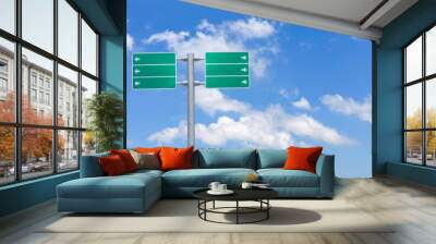 Blank green traffic road sign on sky background. Wall mural