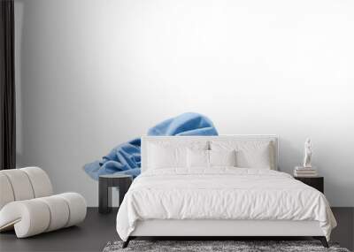 Pile of clothes isolated on white background. Wall mural