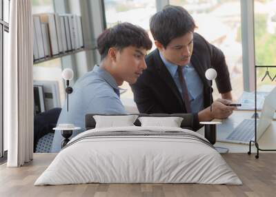 Two young businessmen are discussing Wall mural