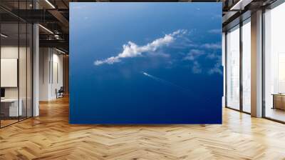 Cuise ship seen from the plane in the mediterranean. Ship in the open sea that leaves behind it, a cloud on the left. Wall mural