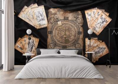 Ancient esoteric witchcraft background. Occultims and paganism old symbol, with mysterious runes alphabet Wall mural