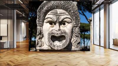 Marble Mask decoration in Ostia Antica theatre. Ancient Rome 1st century mask in the proscenium of Ostia antica, part of architectonic decoration Wall mural