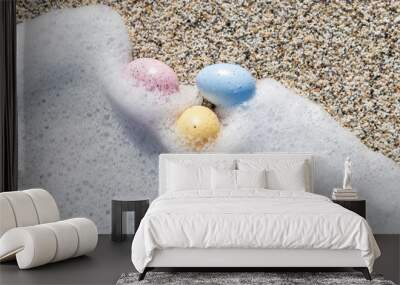 Colorful Easter eggs on the seaside in sunny day. Easter concept. Wall mural