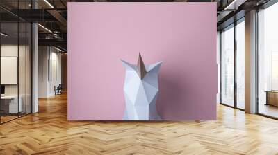 White 3d papercraft model of unicorn head on pink background. Minimal art concept. Wall mural