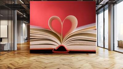 pages of a book curved into a heart shape Wall mural