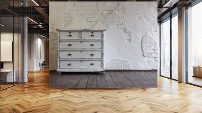 Vintage chest of drawers in the background of the old wall. Vintage interior. Wall mural