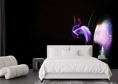 Abstract colorful trace of light in the darkness Wall mural