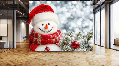 Close up portrait of cute snowman with colorful christmas decoration and snowing in the background Wall mural