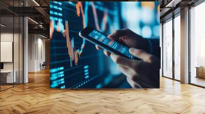 Businessman using a smartphone to monitor stock prices modern portrait investment graph background financial data Wall mural