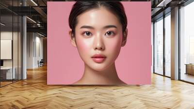 Closeup portrait of young Asian beautiful woman with Korean beauty make up style and healthy and perfect skin isolated on pink background for skincare commercial product advertising. Wall mural