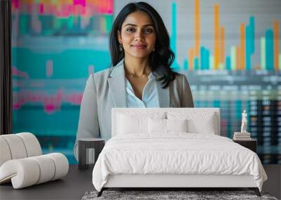 Indian businesswoman standing with a laptop analyzing stock data modern portrait financial chart background Wall mural